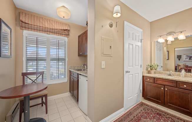 a kitchen and dining room with a table and a sink