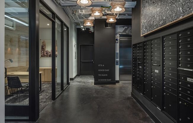 a view of the hallway with lockers and a sign that reads fta company tower