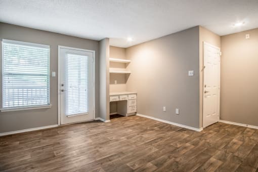 Living Room and Unit Entryway at The Players Club Apartments in Nashville, TN