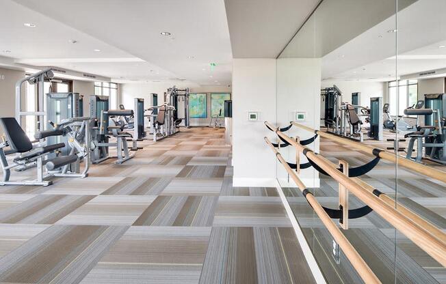 a gym with treadmills and other exercise equipment