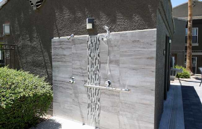 Exterior pool side tiled shower.