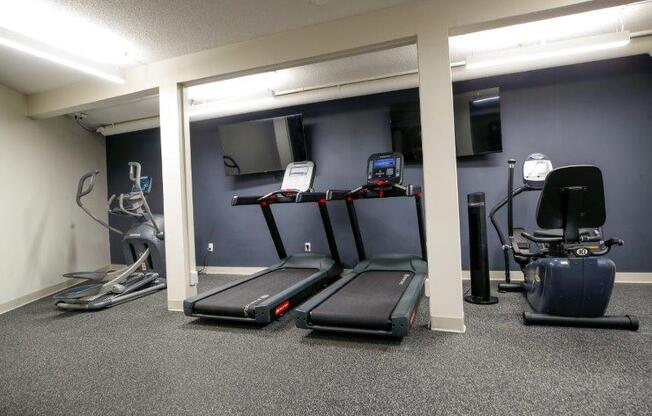 a room filled with lots of exercise equipment