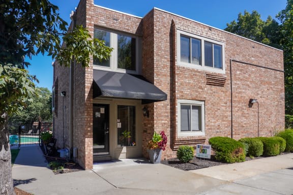 Building exterior with small hedges at The Life at Legacy Fountains, Missouri