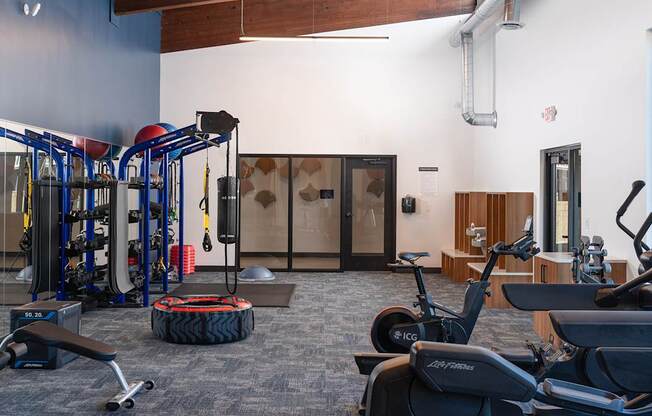 a gym with cardio machines and other exercise equipment