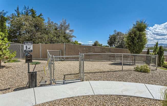 a fenced in area with a chain link fence and a parking meter