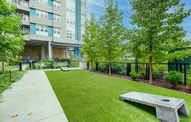 Outdoor courtyard with corn hole at Berkshire Chapel Hill apartments