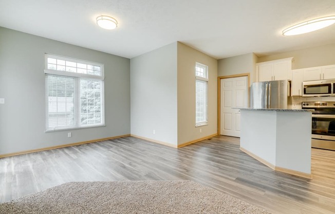 Open floor plan with kitchen and living room at Cascade Pines Duplex and townhomes