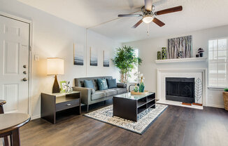 Sophisticated Living Room Remodel With Fireplace at Wildwood Apartments, CLEAR Property Management, Texas, 78752