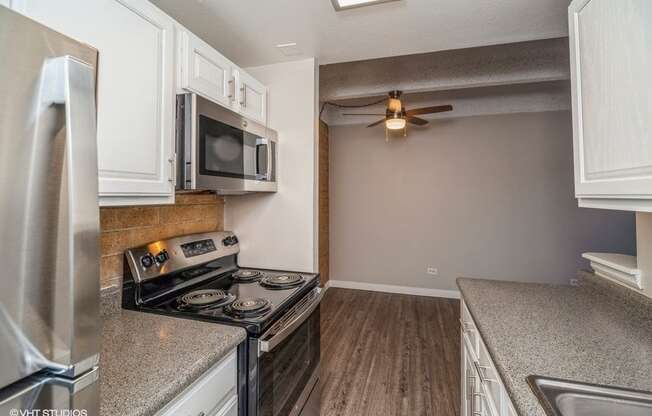 White cabinets and wood-like plank flooring