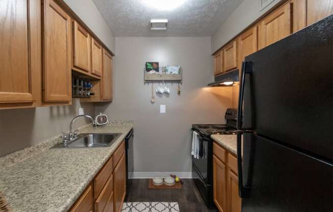 This is a photo of the kitchen in the upgraded 650 square foot, 1 bedroom, 1 bath model apartment at Deer Hill Apartments in Cincinnati, Ohio.