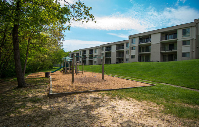 Ashley Apartments Wooded Playground Area Side Photo