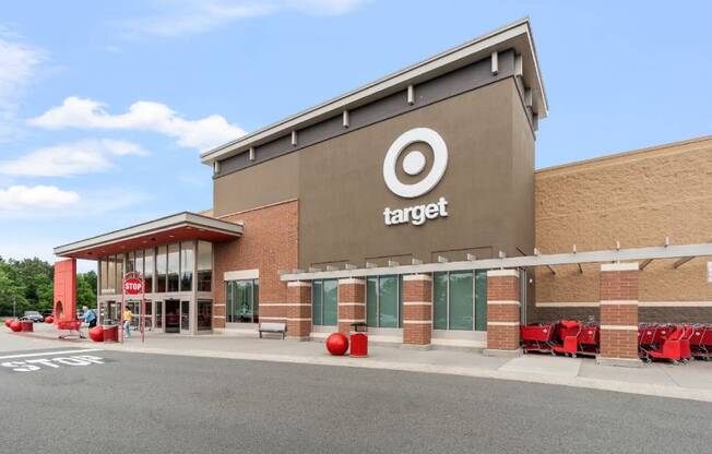 the exterior of a target store with tables and chairs outside