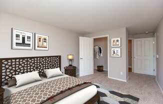 3-Bedroom Apartments in Issaquah, WA - Langara - Bedroom with Carpet Flooring, Full Size Bed, Nightstand with Lamp, Framed Wall Art, and Large Closet.