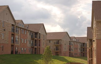 an apartment complex on a cloudy day