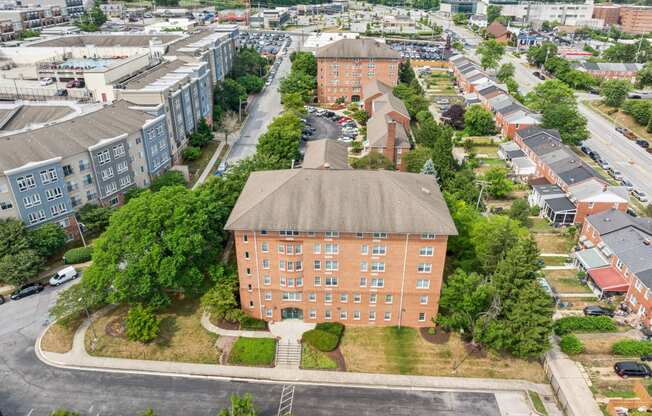 an aerial view of a building in the middle of a city