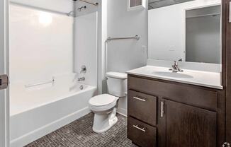 a bathroom with a sink toilet and a bath tub