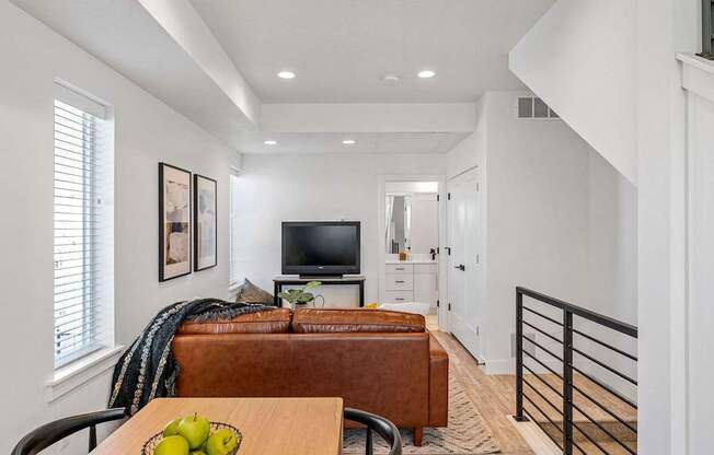 a living room with a couch and a tv