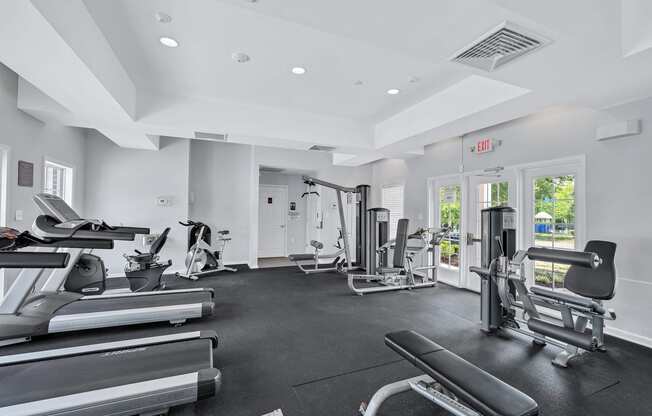 the gym is equipped with cardio equipment and free weights