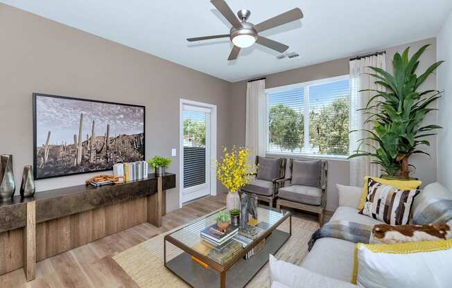 a living room with a couch and a ceiling fanat Weylyn Luxury Apartments, Arizona