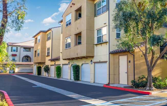 an empty street in front of an apartment building