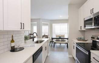 Newly renovated include quartz countertops, stainless steel appliances, matte black finishes and hardware, and hardwood-inspired flooring throughout (Legacy Series)