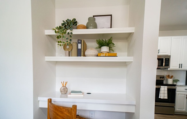a kitchen with a desk and a wall with the wordrupal on it