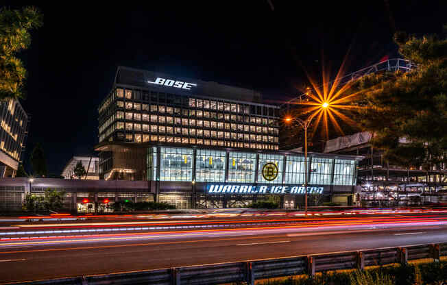 Bose sign lit up at night at Boston Landing, Allston MA