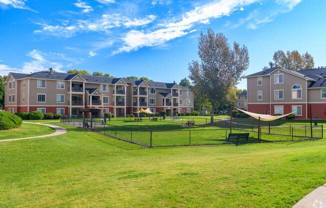 an apartment complex with a park and a playground