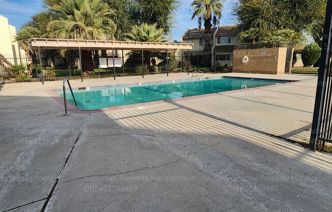 Charming 3 bedroom, 2.5 bathroom condo located in a North Bakersfield gated community.