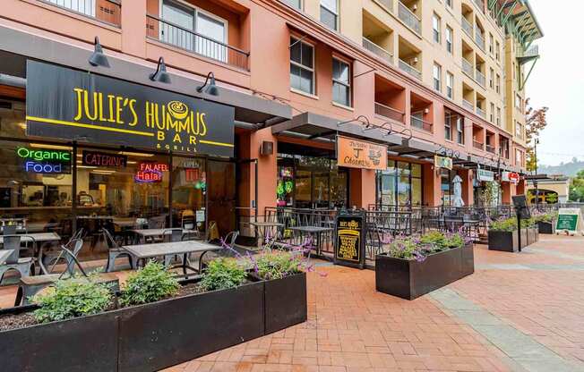 A restaurant named Julie's Hummus Bar is located in a shopping center.