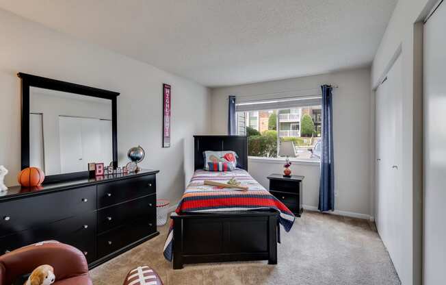 Bedroom Featuring Large Windows