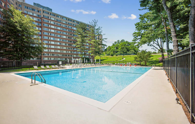 a large swimming pool in front of a building