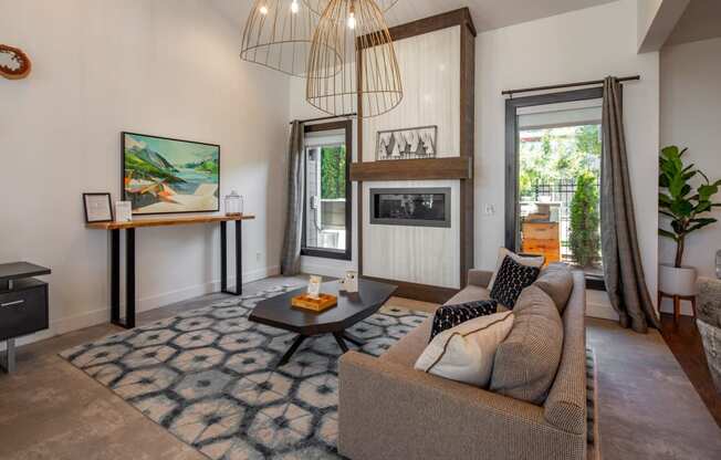 a living room with a couch and a fireplace