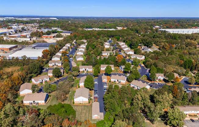 A bird's eye view of a residential area with houses and trees.