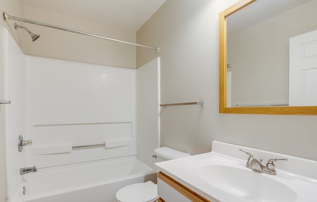 a bathroom with a bathtub and a sink