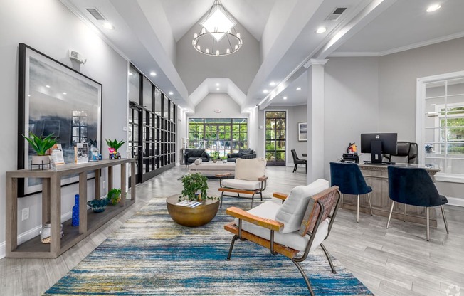 A modern living room with a large rug and a wooden chair.