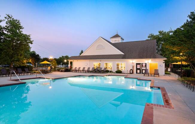 a pool with a white building in the background