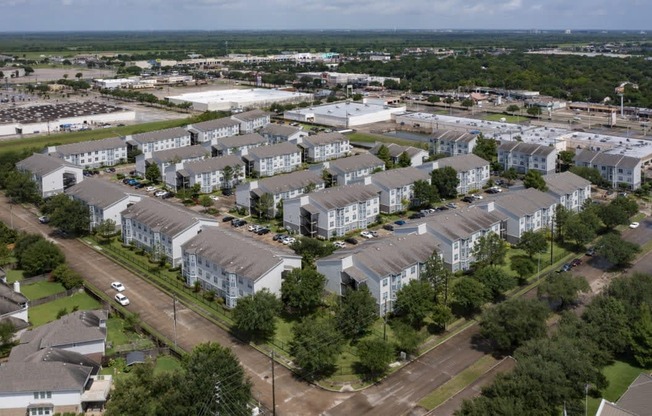 an aerial view of an apartment complex in the suburbs