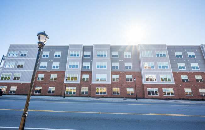 a building with the sun shining in front of it