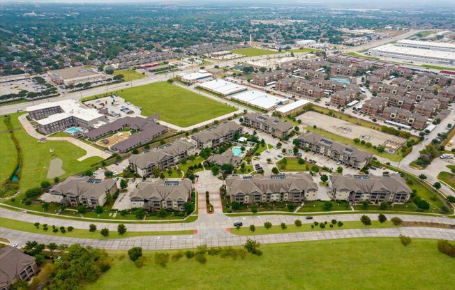 an aerial view of a neighborhood of houses and lawns