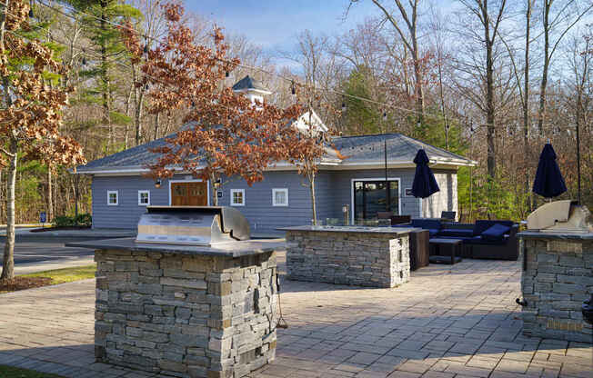 A house with a stone pillar in front of it.
