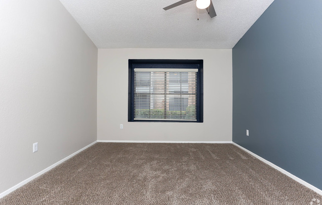 bedroom with ceiling fan without staging furnature