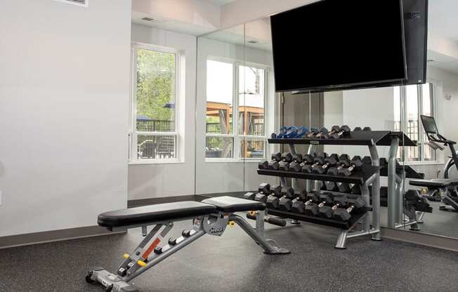 fitness room with weightsat Urban Park I and II Apartments, St Louis Park, Minnesota