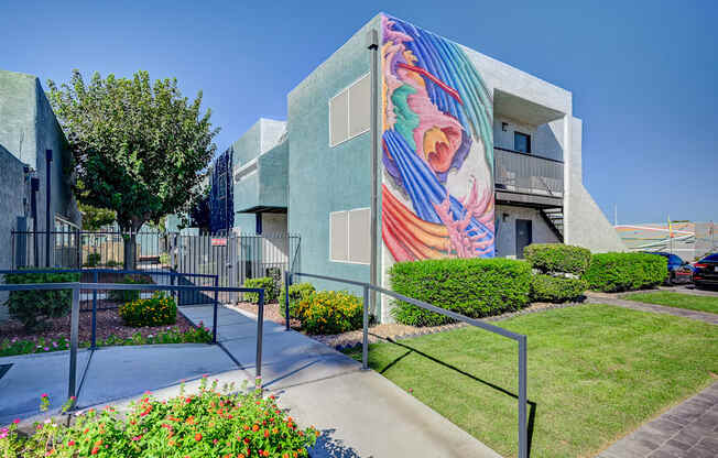 A modern building with a colorful mural on the side.