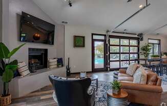 A modern living room with a fireplace and a television.