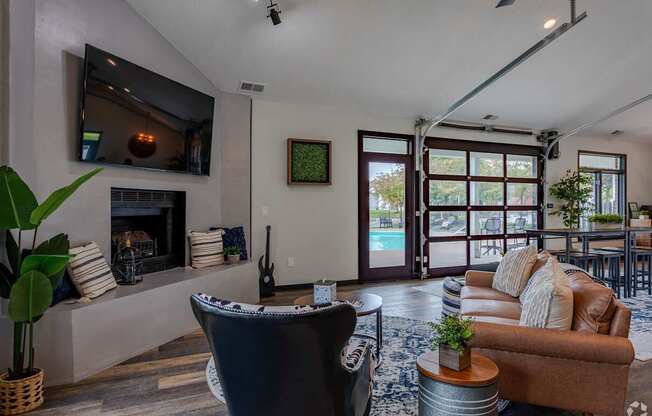 A modern living room with a fireplace and a television.