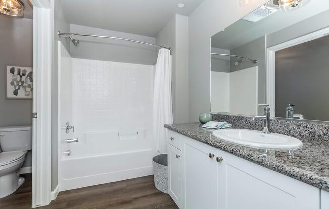 a kitchen with a sink and a mirror
