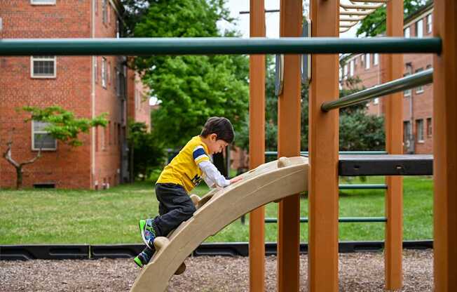 boy on playground at Hamilton Manor Apartments, Maryland, 20782