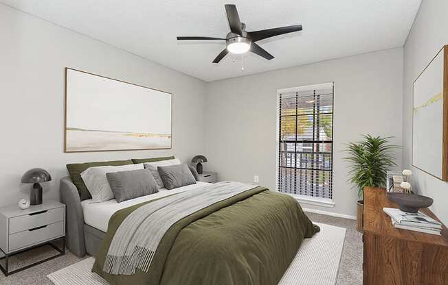 Model Bedroom with Carpet and Window View at Grand Pavilion Apartments in Tampa, FL.