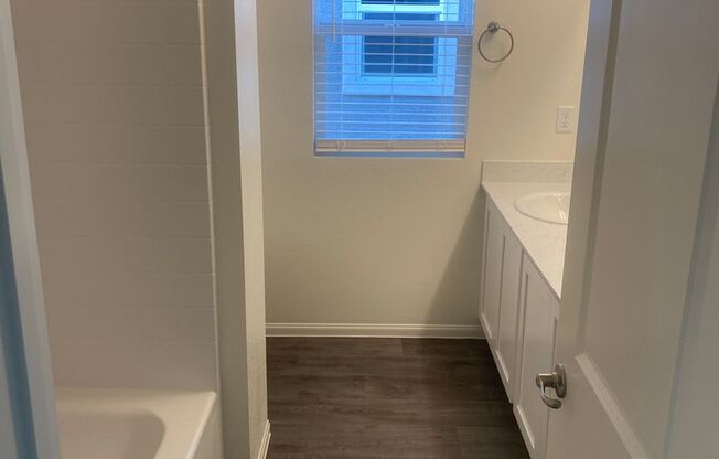 brand-new with two car garages, four bedrooms plus a loft, and two and a half bathrooms.